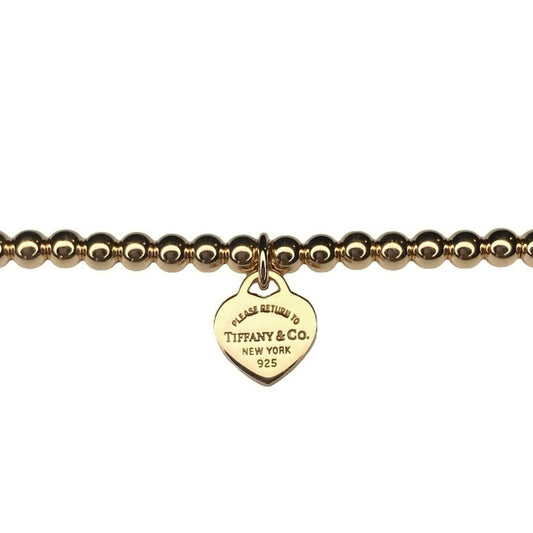Tiffany & Co. goldplated heart on extra ball bracelet