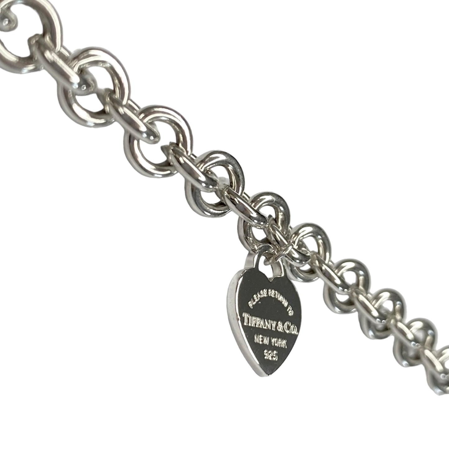 Tiffany & Co. link bracelet with a silver heart pendant