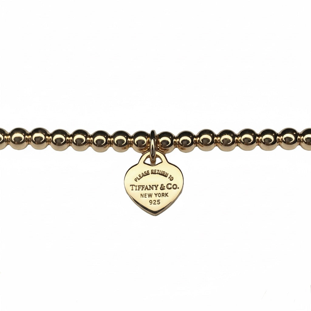 Tiffany & Co. vergoldeter Herzanhänger an extra Kugelarmband