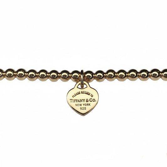 Tiffany & Co. vergoldeter Herzanhänger an extra Kugelarmband