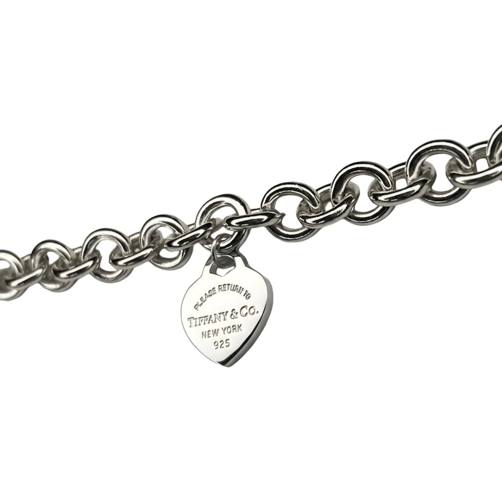 Tiffany & Co. link bracelet with a silver heart pendant