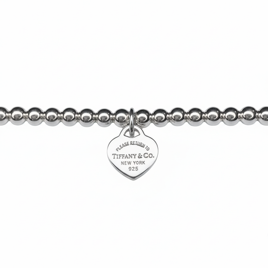 Tiffany & Co. silver heart on extra ball bracelet