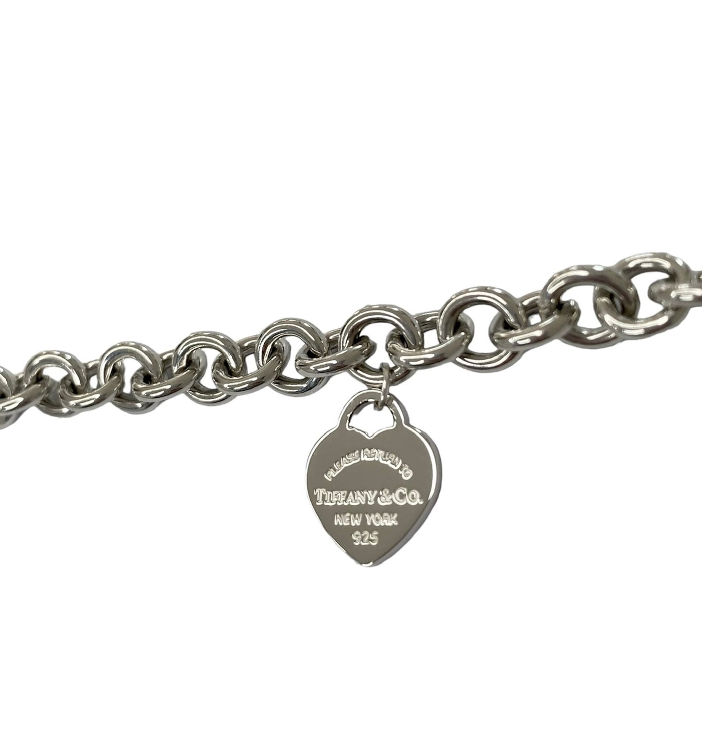 Tiffany & Co. link bracelet with a silver heart pendant