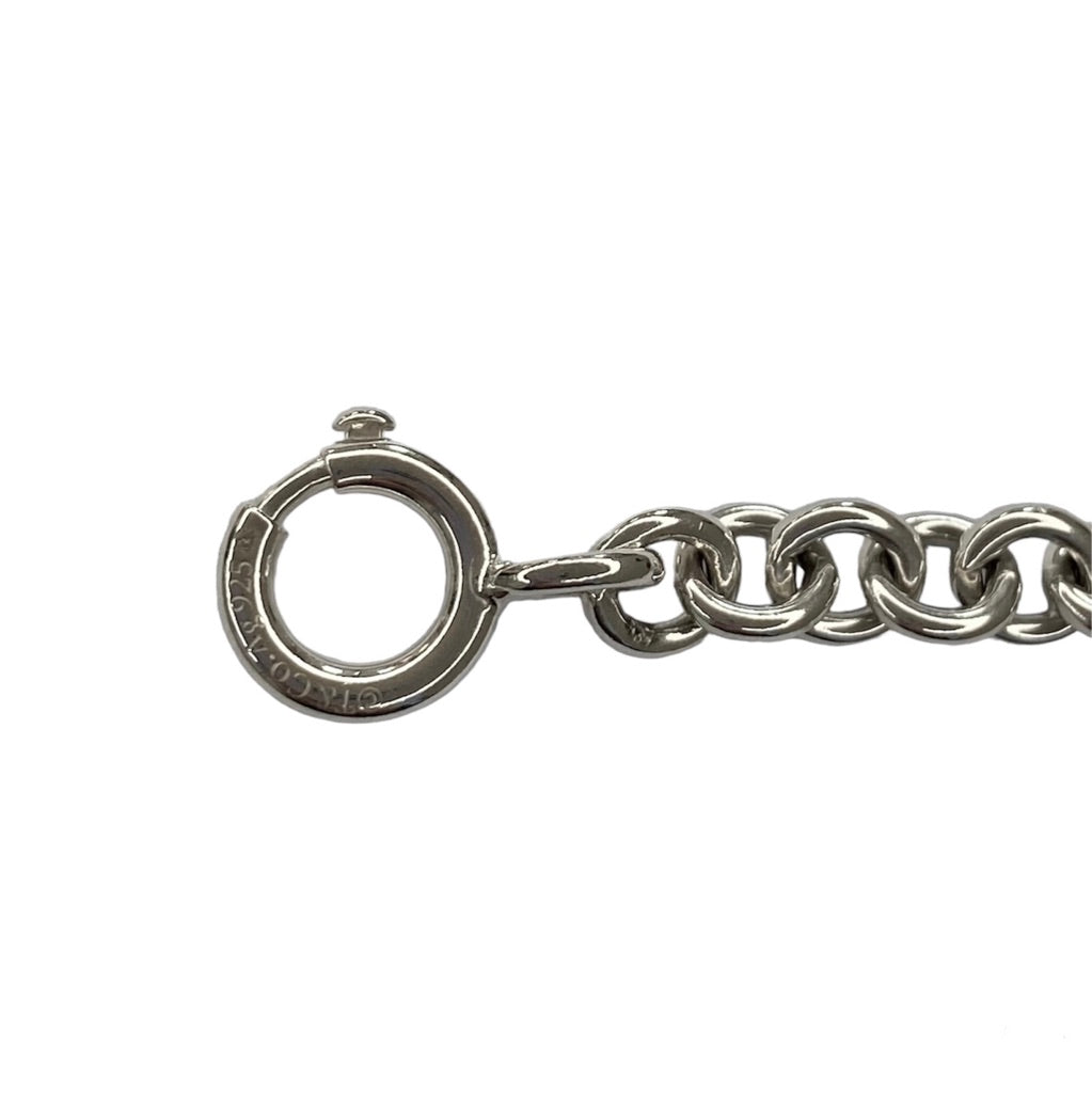 Tiffany & Co. link bracelet with a silver heart pendant